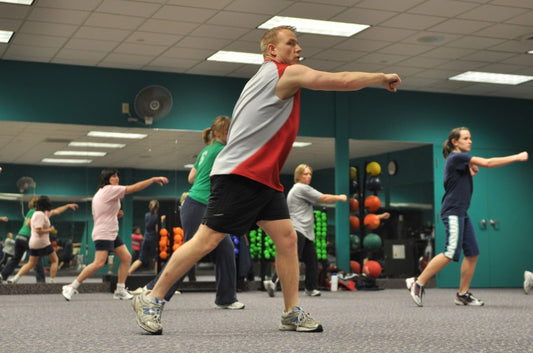A group boosting their cardiorespiratory performance in the gym